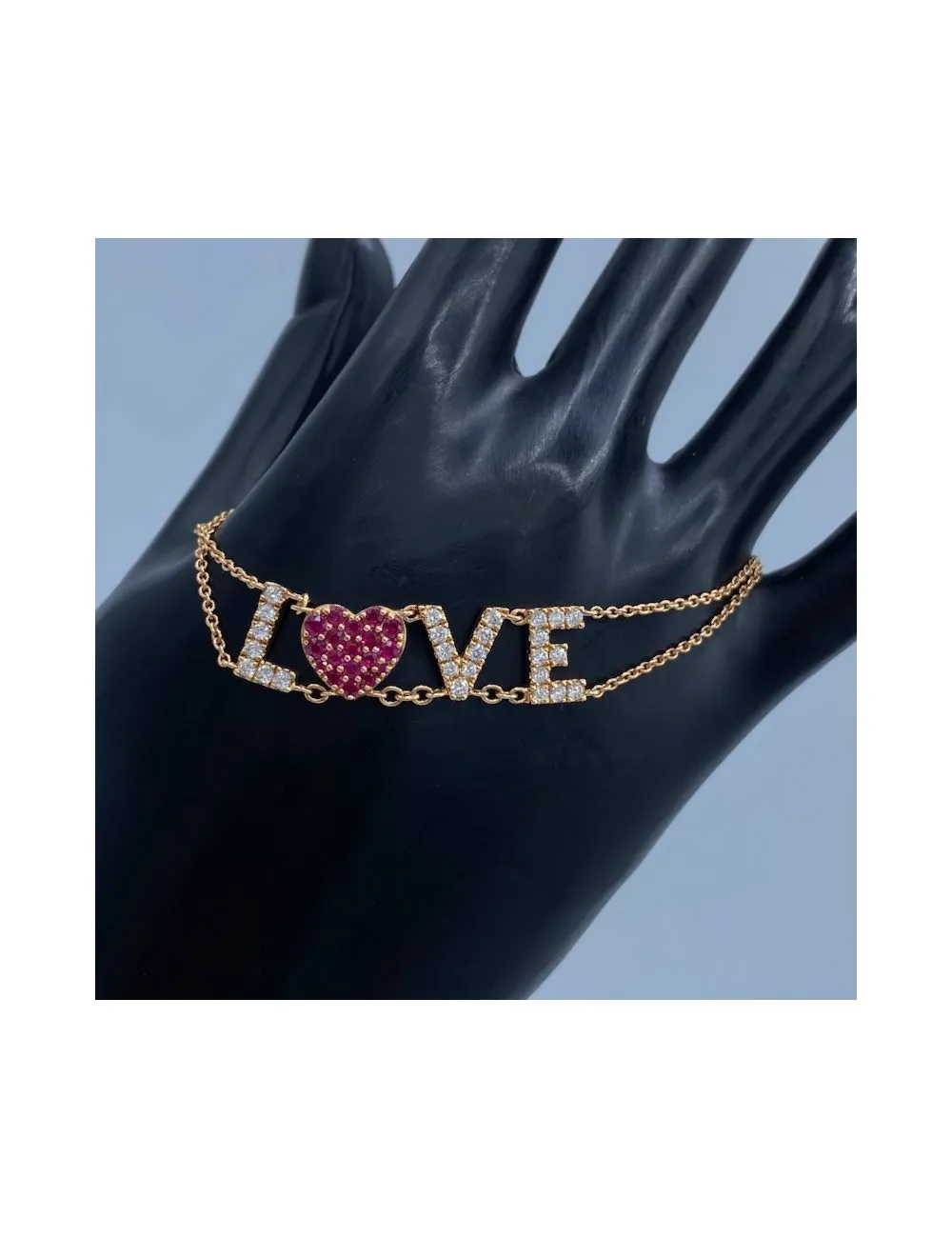 Bracciale in oro rosa con LOVE in Diamanti e Rubini