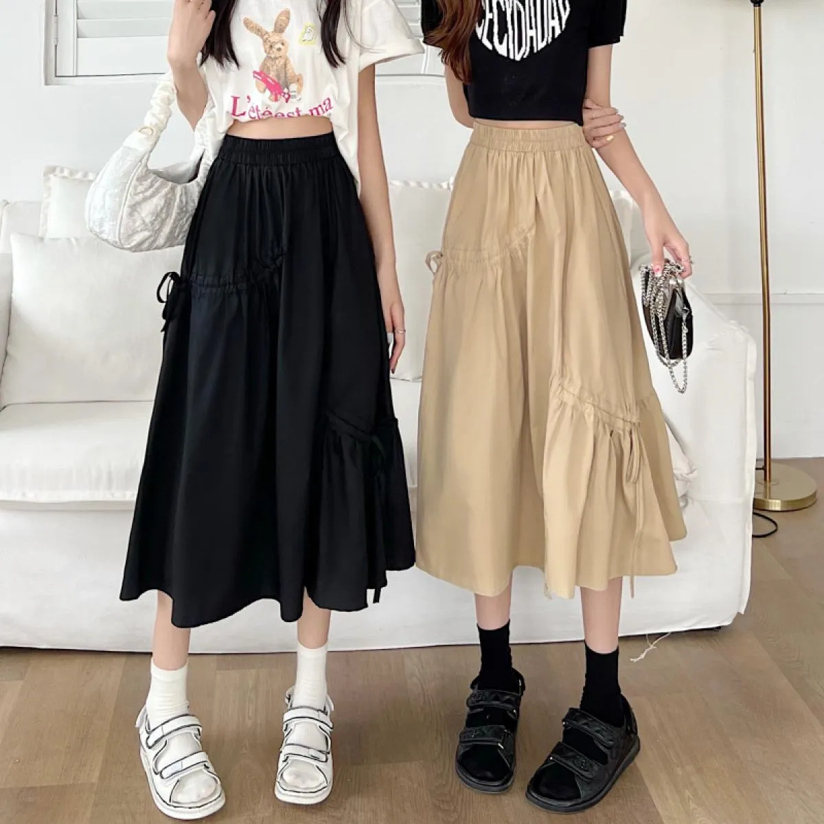 Gonne a metà polpaccio Donna Solid Estate Nuovo arrivo Design irregolare Vita alta Elegante Amici Shirring Jupe Femme Streetwear